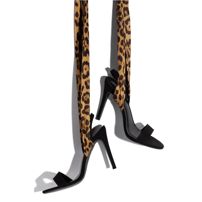 Light brown leopard print women's strappy high heel sandals with stiletto heel and cross-strap design