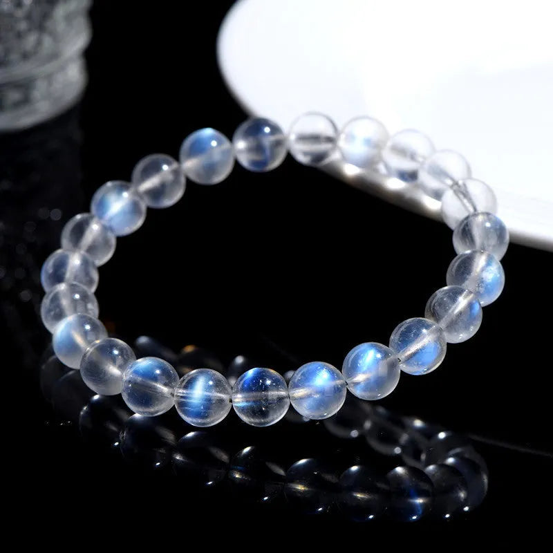 Natural cream body blue moonlight crystal bracelet on a white background showing grinding finish.