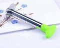 Stainless steel pineapple corer slicer with coloured plastic handle on a kitchen worktop.