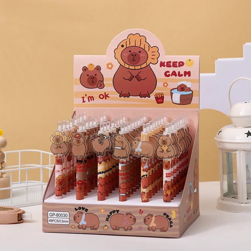 Open box showing 48 cartoon bear design acrylic gel pens with plastic bodies and black ink.