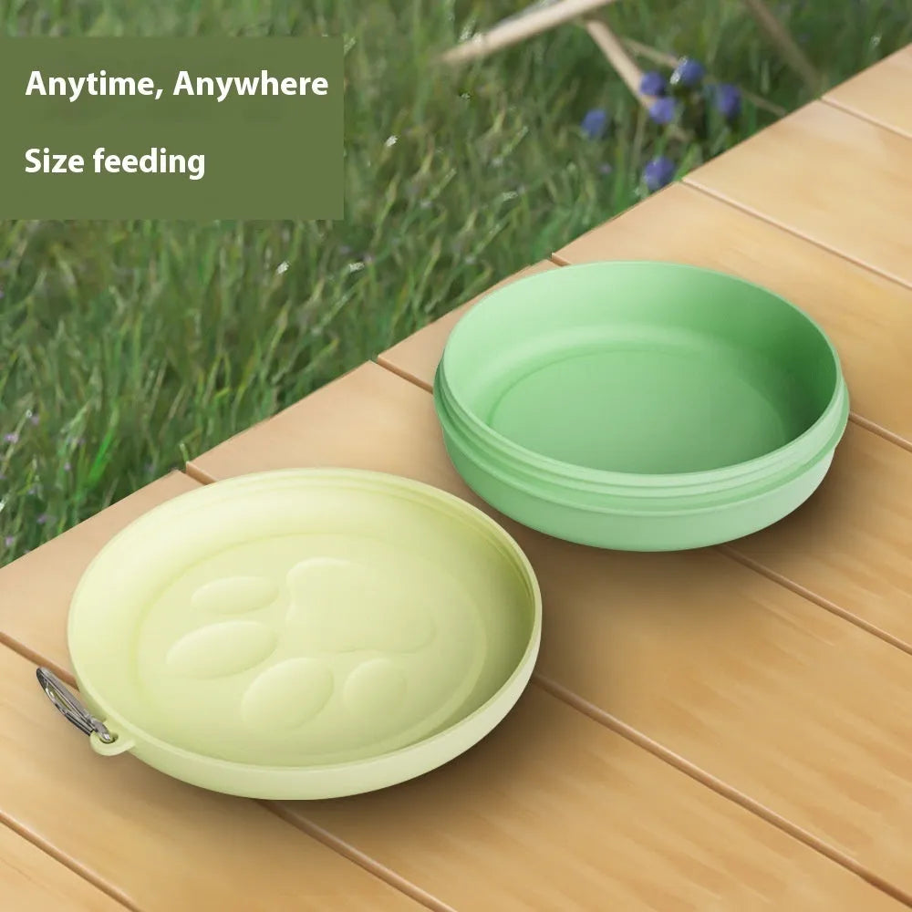 Green and pink portable silicone dog bowl with two compartments, shown folded and unfolded