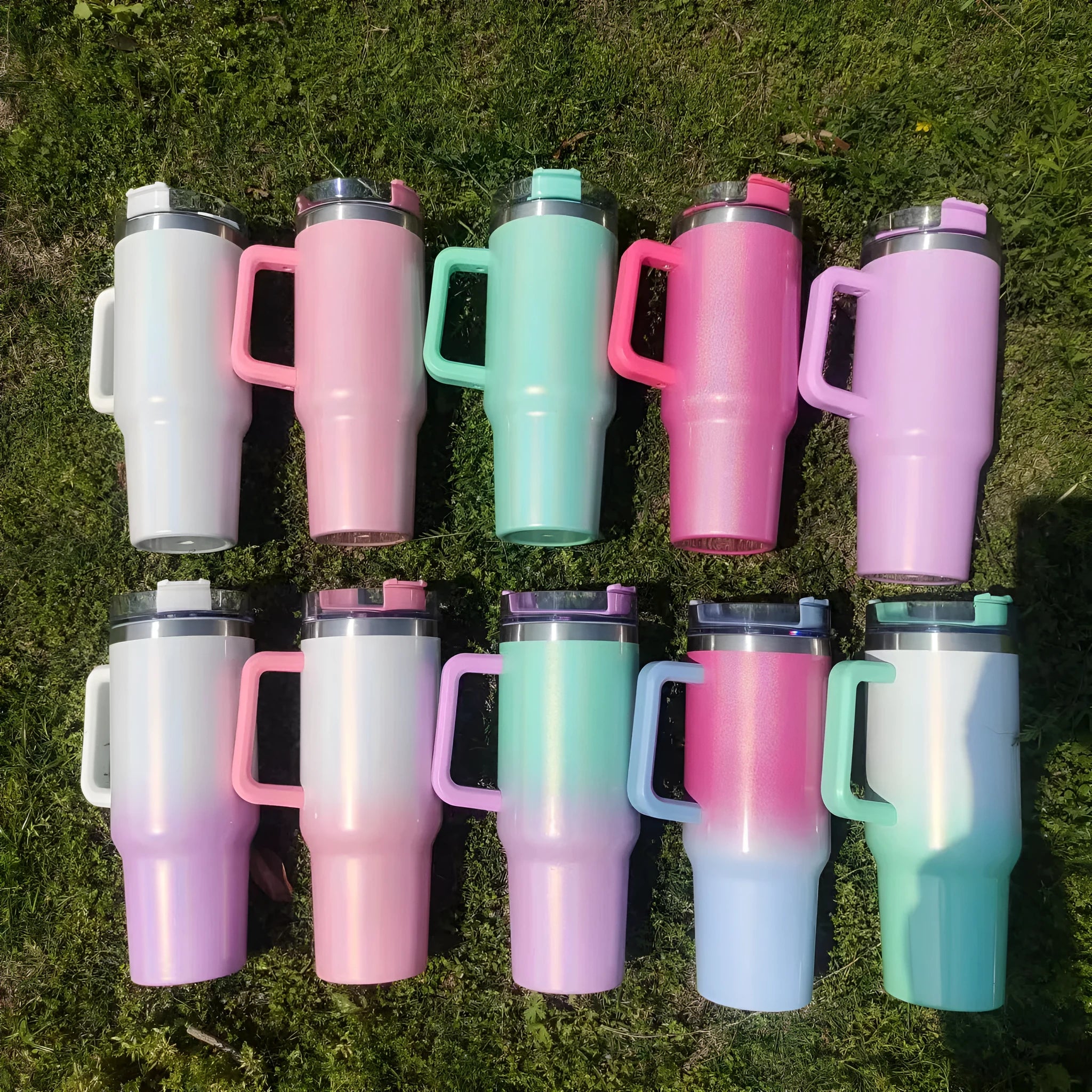 Large stainless steel vacuum insulation cup in a gradient colour, showing its tall 27.5 cm cylindrical shape.