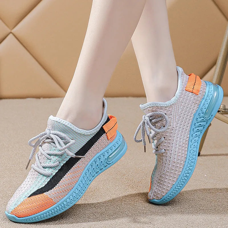 Women's lightweight casual running shoes in purple, black and orange colours with front lace-up design