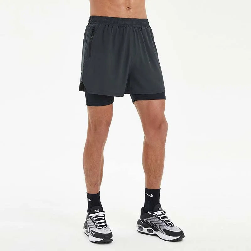 Men's black double-layer running shorts with built-in liner shown on model