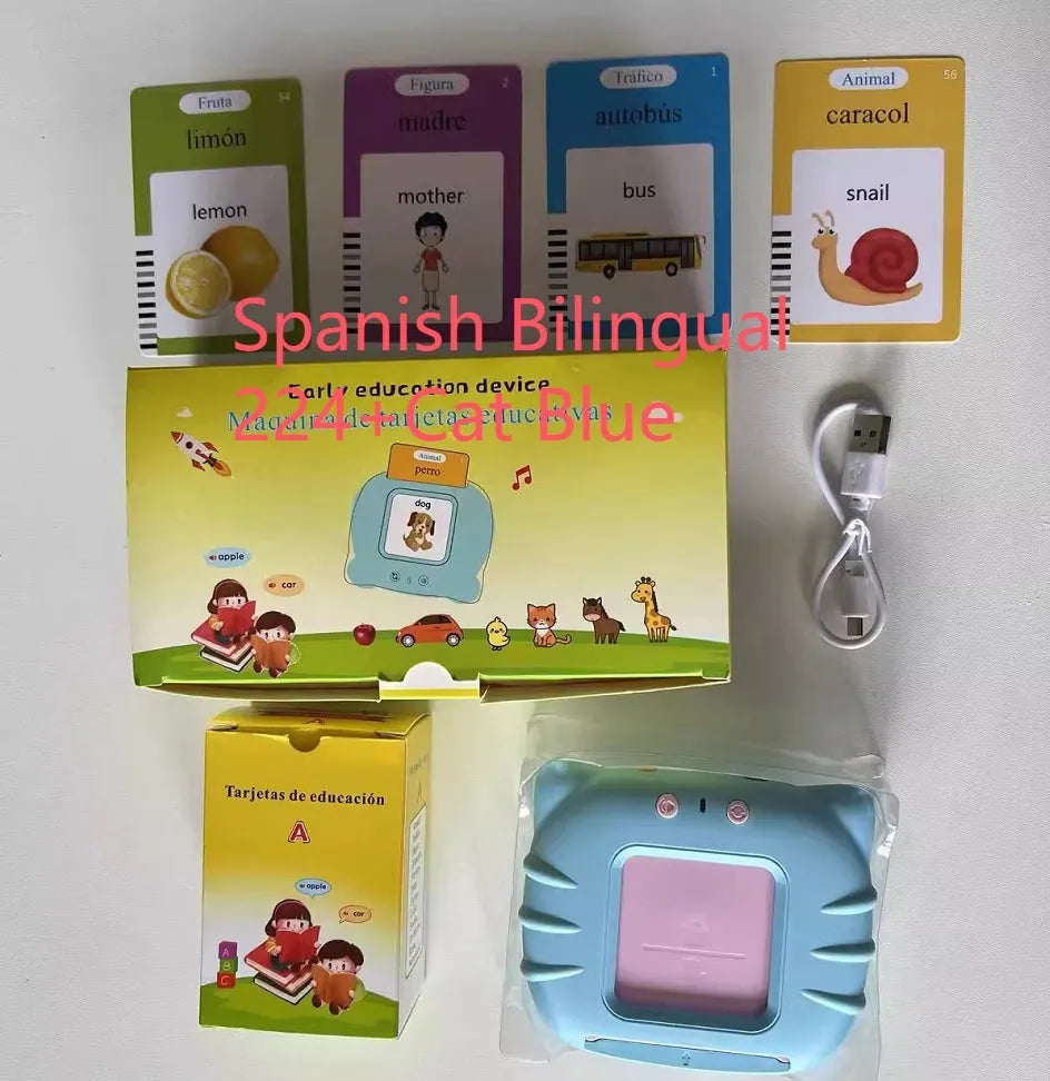 Blue children's learning machine with audio book cards on a table