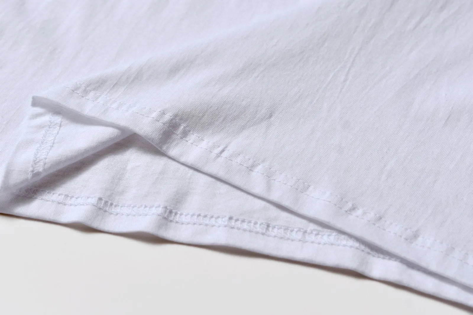 White cotton overalls with round neck and short sleeves in loose pullover style