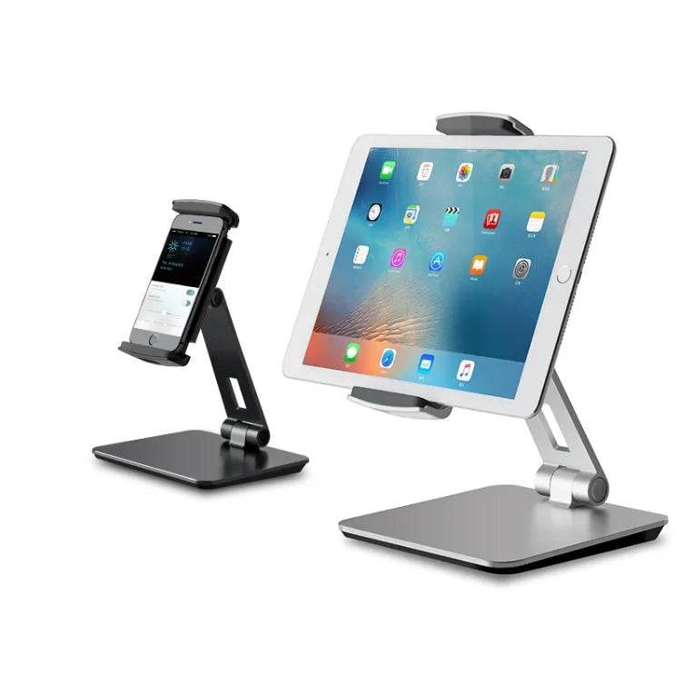 Folding aluminium phone and tablet stand with black silicone pads, shown holding a tablet at an angle.