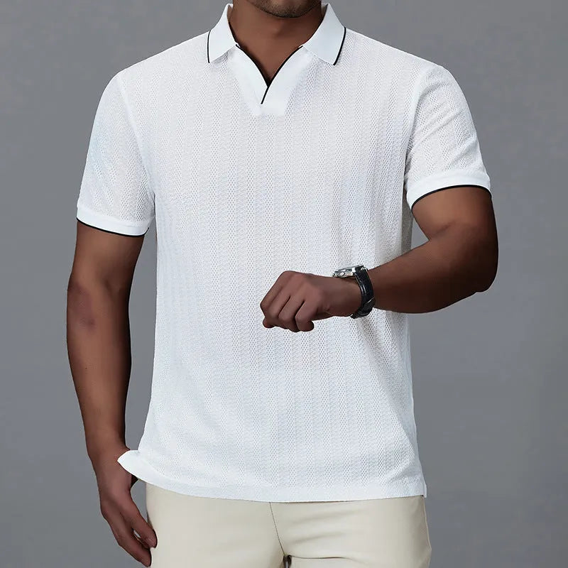 Man wearing a loose-fit black nylon polo shirt, short sleeves, casual style.