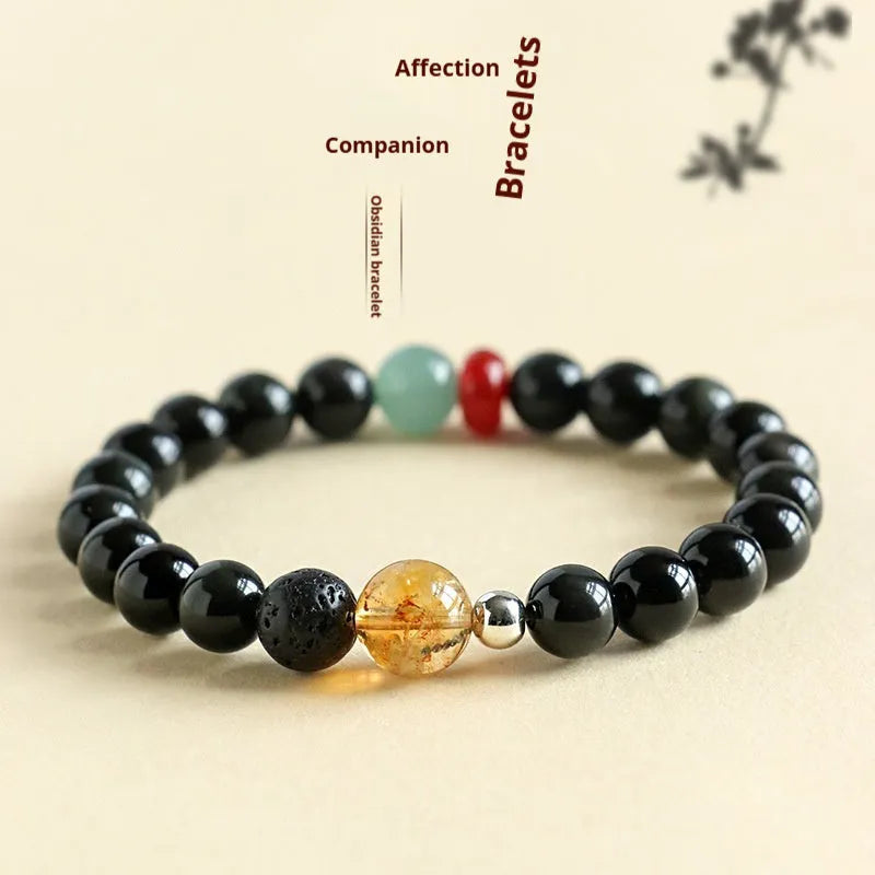 Chinese style obsidian yellow tower crystal and agate jade beaded bracelet shown in 8mm and 10mm bead sizes