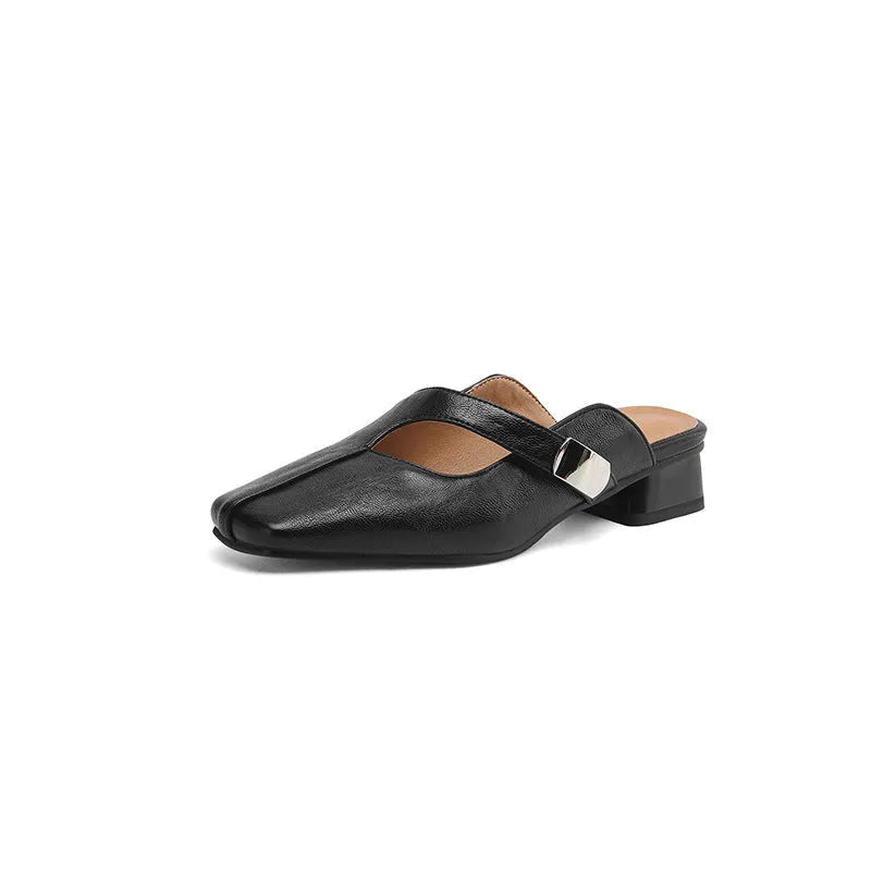 A pair of casual square-toe low-heel slippers in a solid colour on a rubber sole.