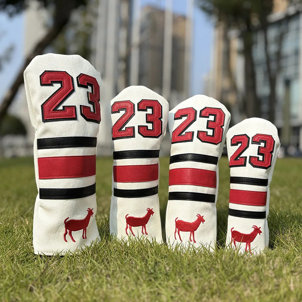 Set of coloured chicken drumstick design golf club head covers for fairway woods, a square putter, and irons.
