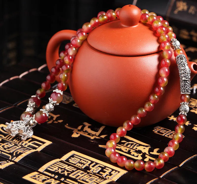 Handmade natural watermelon crystal bracelet with Chinese knot design and geometric beads in elephant style colours