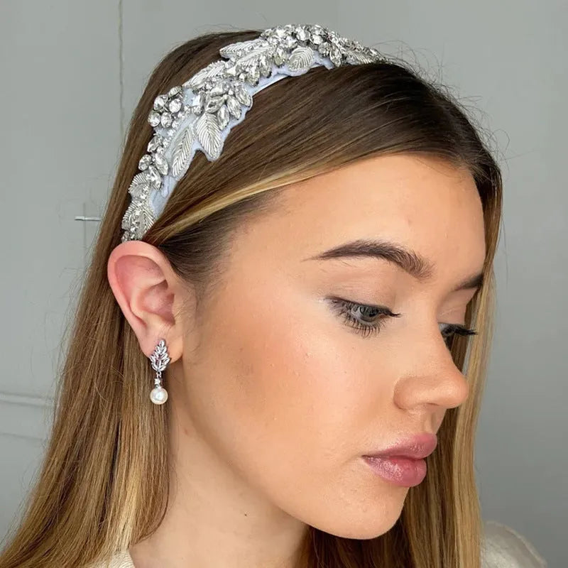 Geometric flower earrings with micro inlaid zircon stones in gold, platinum, or rose gold plating.