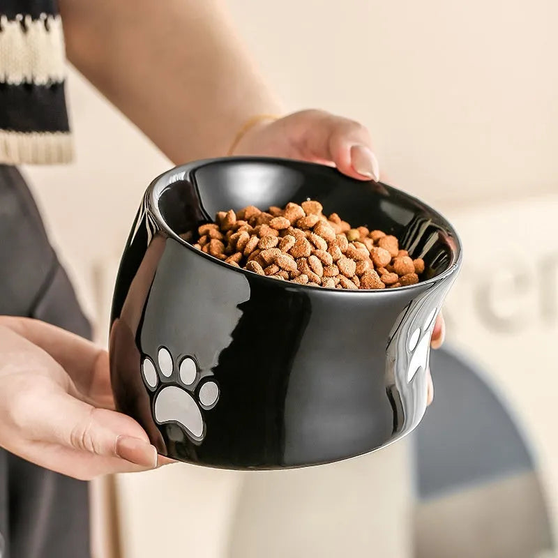 Ceramic cat food bowl with high foot and cat's paw pattern in chosen colour