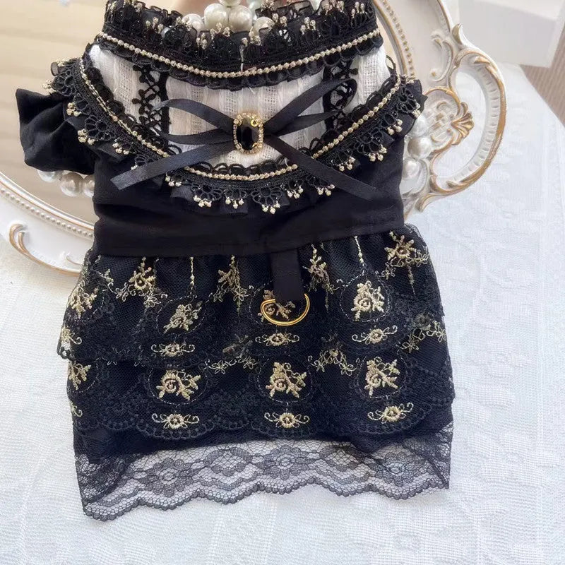 Golden Gothic princess-style skirt pet clothing for a small dog or cat on a mannequin.
