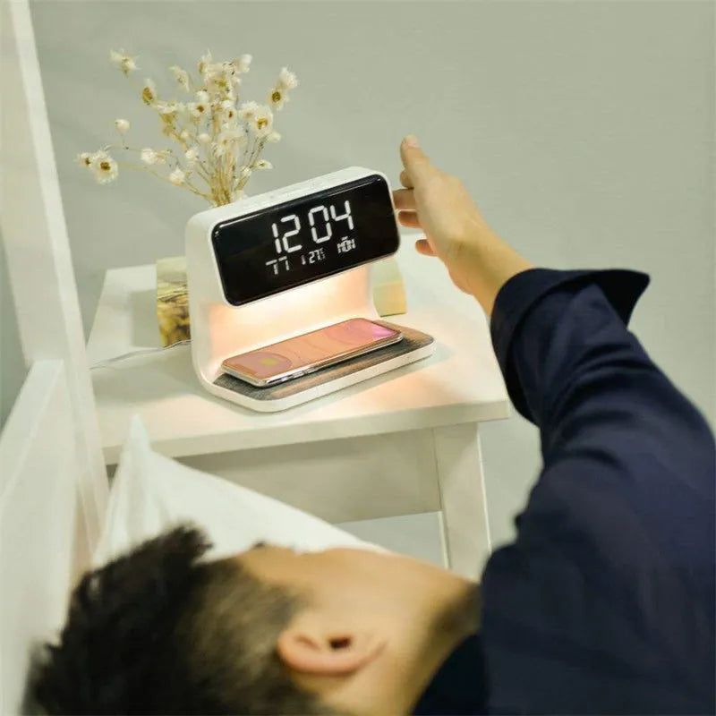 White 3-in-1 bedside lamp with wireless charging pad, LCD clock screen, and fabric-effect ABS shade.