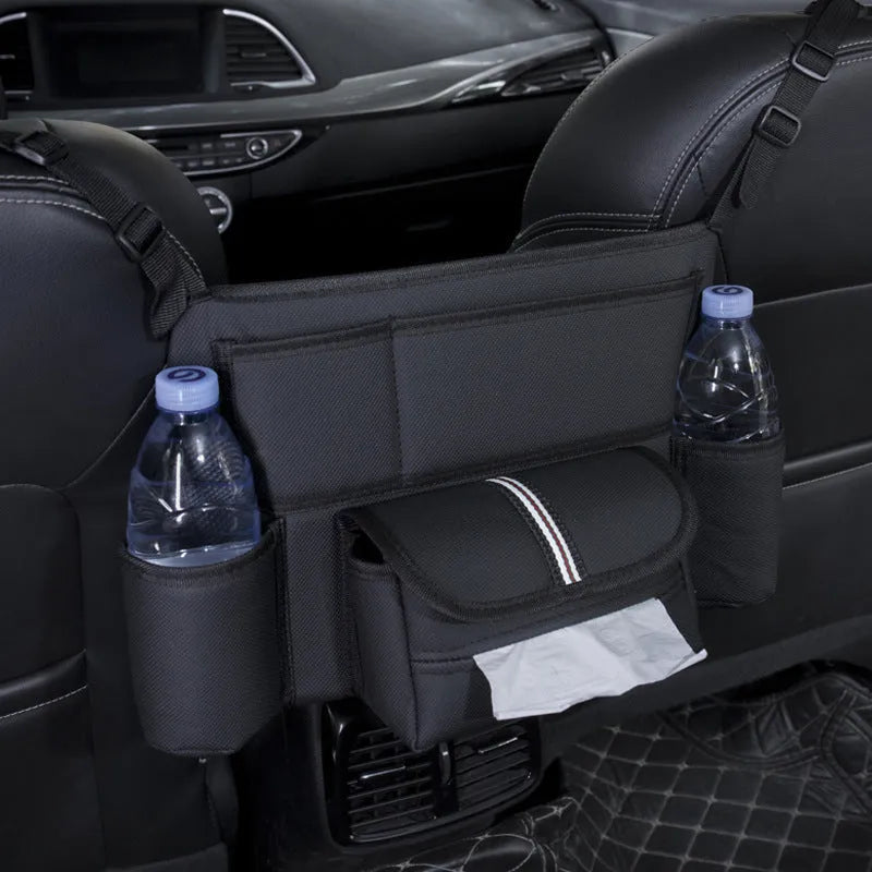 Black leather car seat hanging storage organiser for tissue boxes, shown between vehicle front seats.