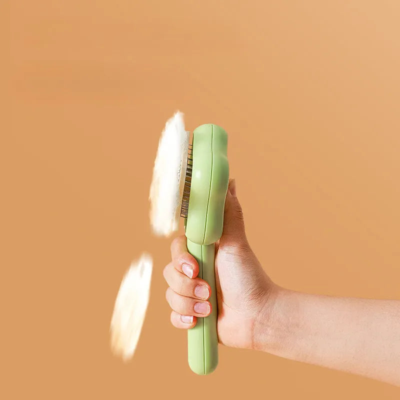 Magic Wand self-cleaning pet comb with stainless steel teeth in green colour