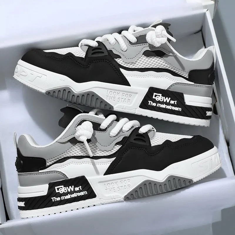 Men's low-top white and beige board shoes with a soft rubber sole and mesh lining.