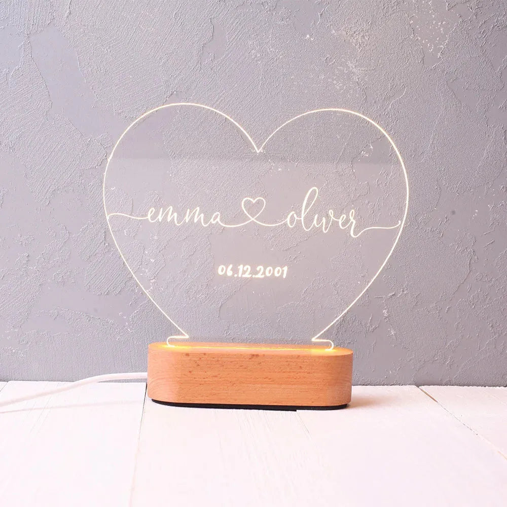 Custom transparent acrylic night light with LED base showing personalised text