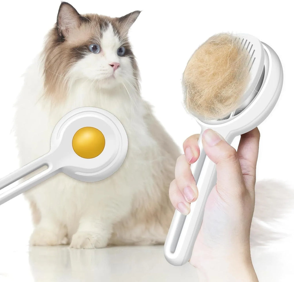Yellow cat brush with release button and stainless steel bristles on a light background