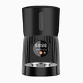 Black and white automatic pet feeder with smartphone app showing feeding schedule