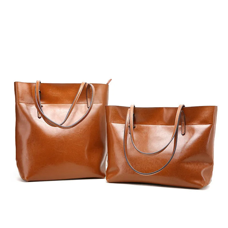 Brown leather crossbody handbag with multiple internal compartments showing dimensions 30cm wide by 37cm high.