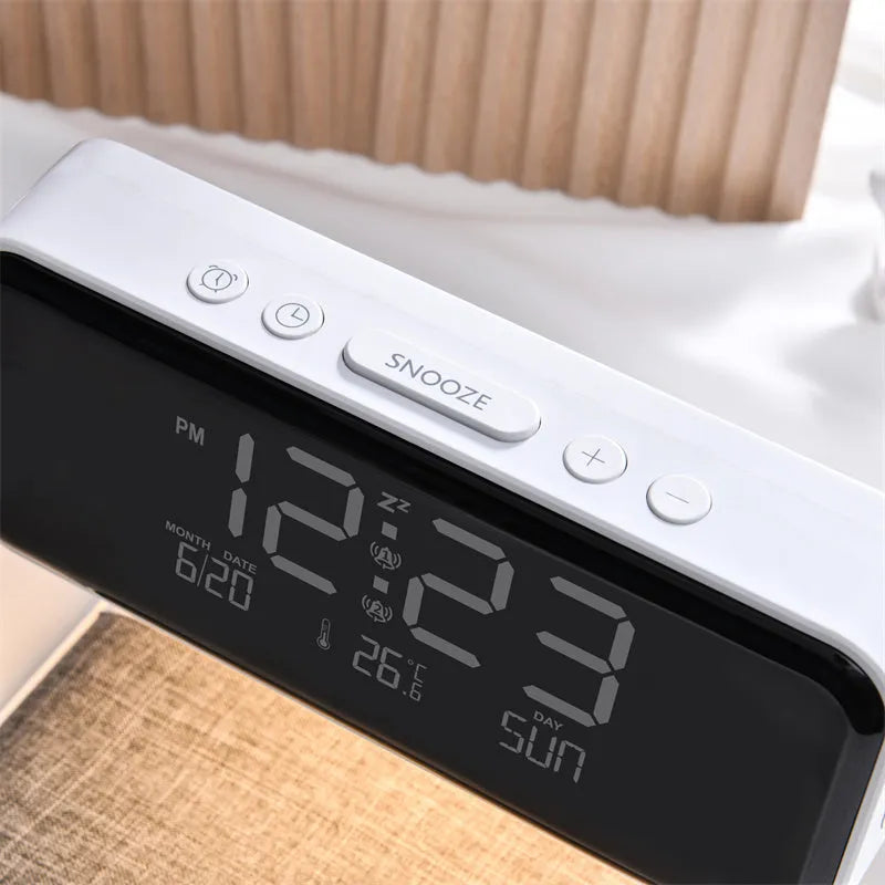 White 3-in-1 bedside lamp with wireless charging pad, LCD clock screen, and fabric-effect ABS shade.