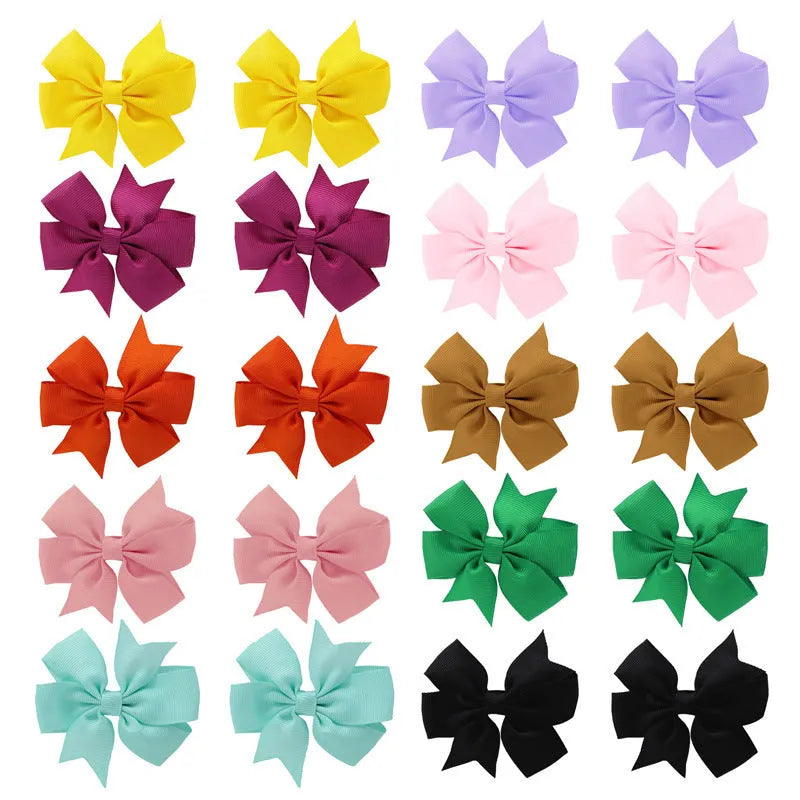 20 pairs of multicoloured 3-inch grosgrain ribbon pinwheel hair bows with alligator clips for baby girls.