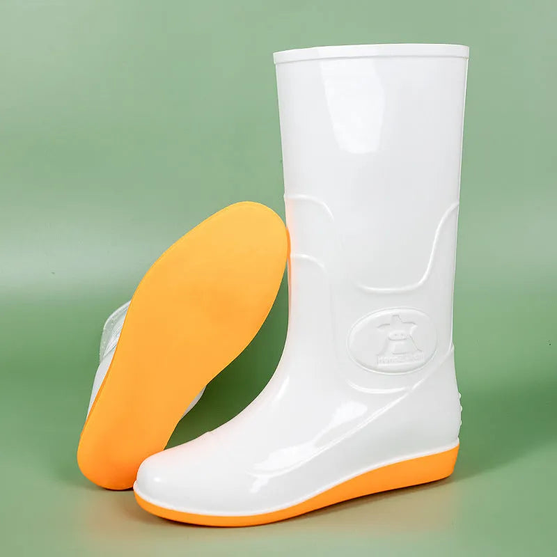 Flat washable plastic rain boots in white with high tube design and round toe