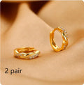 Women's geometric hoop earrings with interwoven rope pattern in gold colour