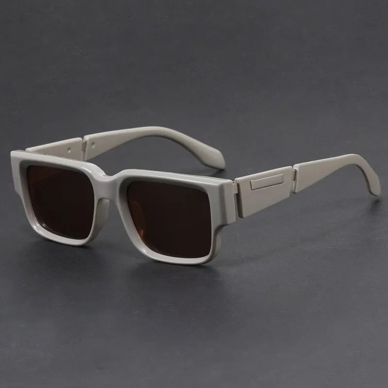 Blue frame retro square sunglasses with grey blue lenses and thick arms.