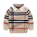 Boys apricot and navy blue plaid jacquard knit sweater with long sleeves on hanger.