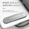 Silver aluminium laptop extension bracket holding a phone next to a computer screen.