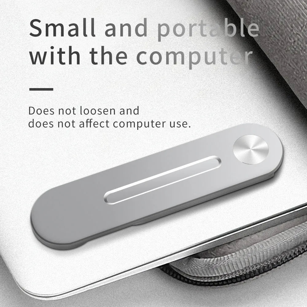 Silver aluminium laptop extension bracket holding a phone next to a computer screen.