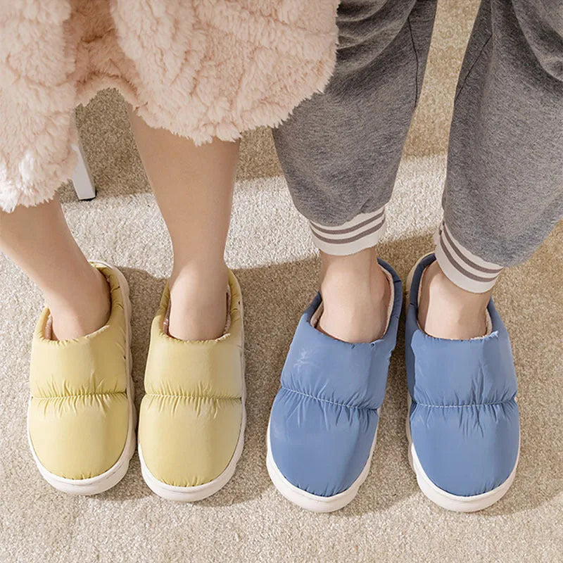 Down cotton house slippers with artificial leather upper, rubber sole, and plush lining in blue colour