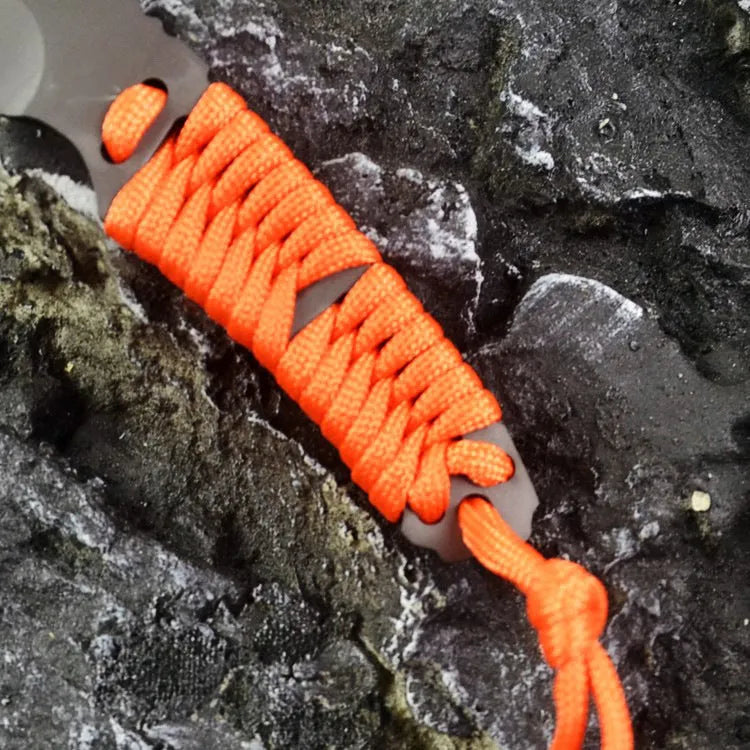 Multi-function survival knife with straight blade and rope handle showing ABS sheath