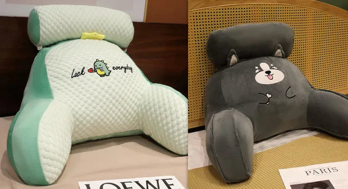 Triangle-shaped fluffy reading cushion on a chair, showing embroidered husky design and detachable cover.