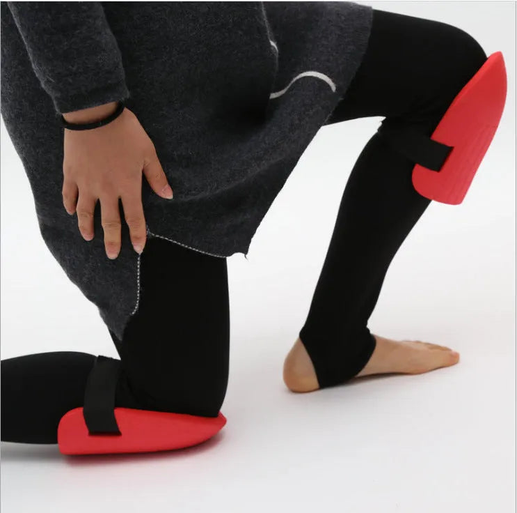 Pair of rectangular EVA foam knee pads in chosen colour on a garden surface
