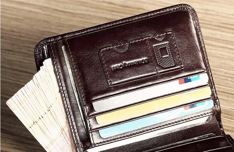 Men's brown leather bifold wallet open to show card slots, coin pocket, and banknote compartment.