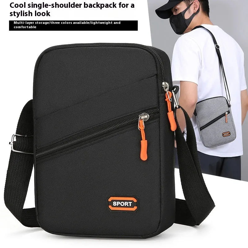 Oxford cloth ultra-light crossbody commuter bag in solid colour with contrasting details.