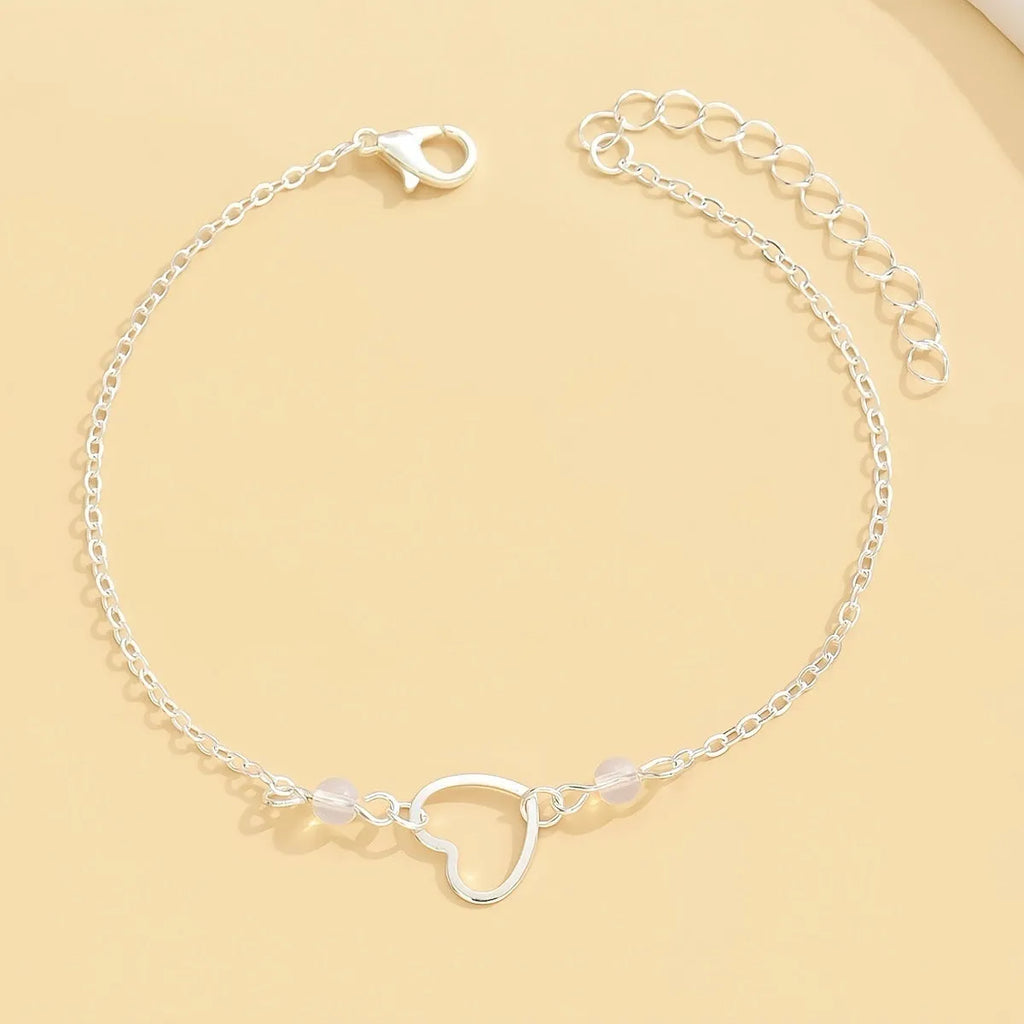 Adjustable women's anklet with heart pendant in gold or silver alloy