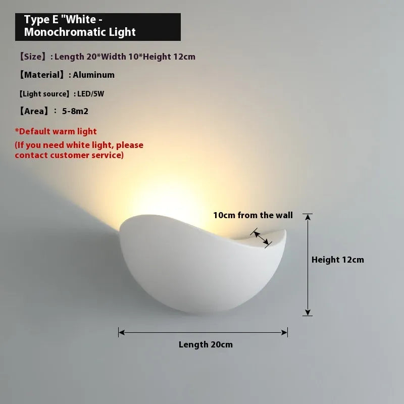 Black bird's nest design outdoor waterproof LED wall lamp with IP65 rating mounted on a wall.