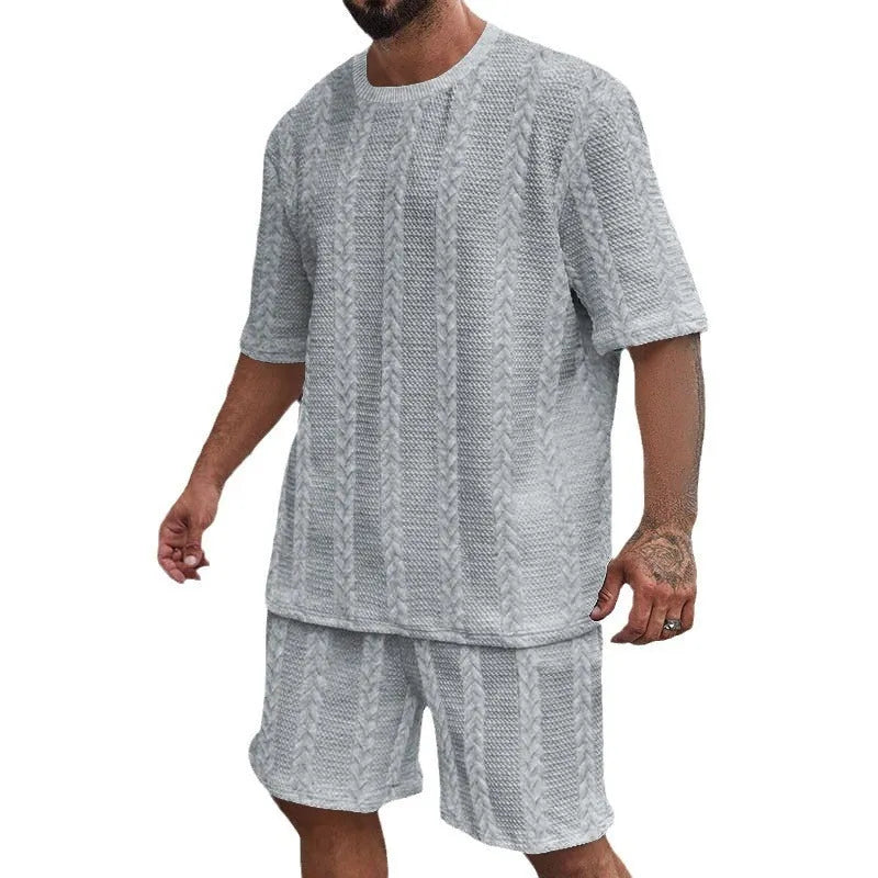 Knitted short sleeve pullover and matching shorts set in a solid colour with jacquard pattern.