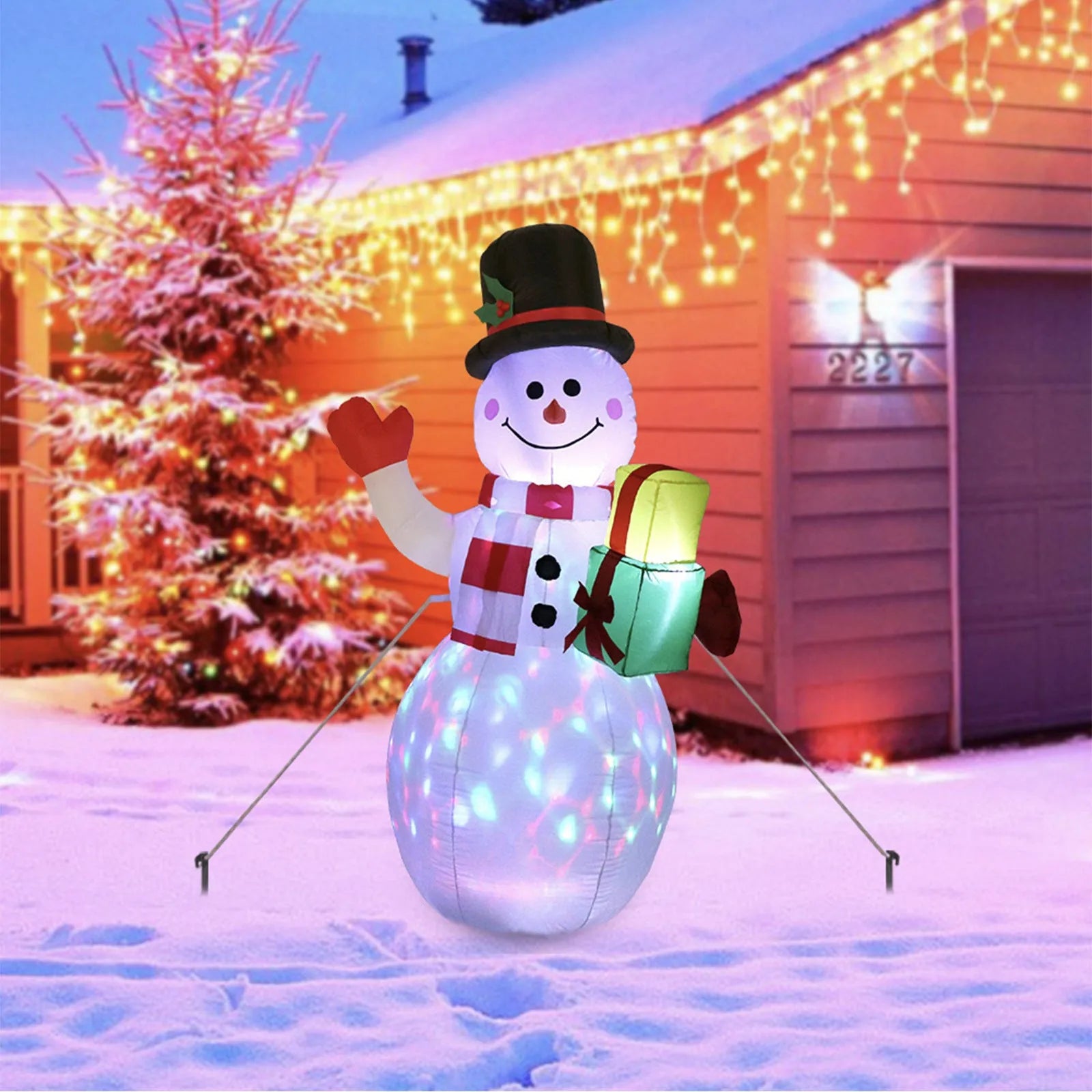 Outdoor Christmas inflatable decoration with LED lights showing Santa, snowman, and tree designs