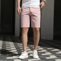 Men's elastic waist fifth pants in polyester fabric showing mid-length design and solid colour options