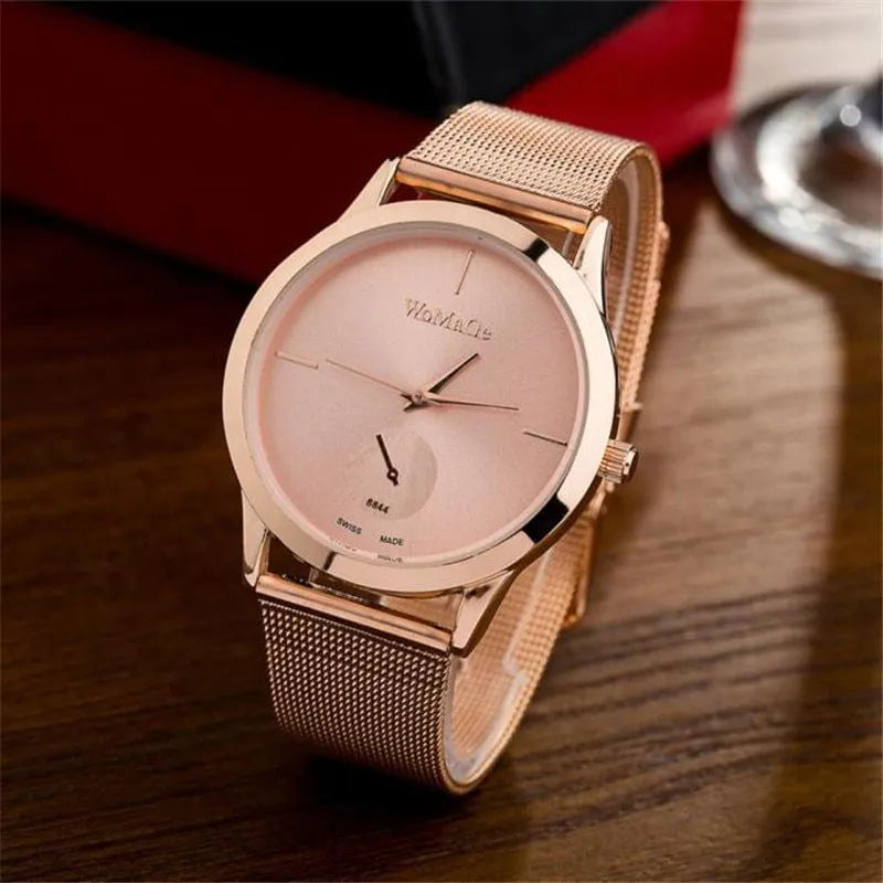 Unisex alloy mesh quartz watch with round silver case and dial on wrist
