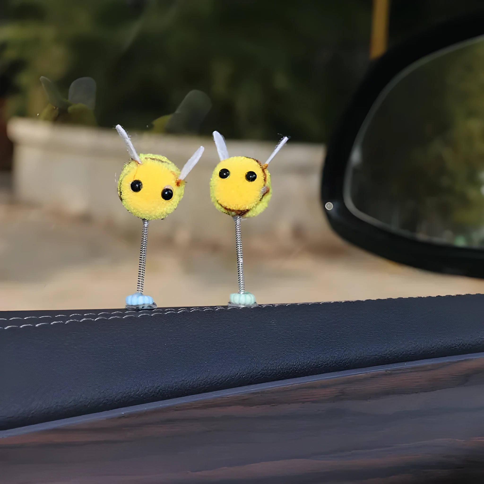 Swing Spring Bee soft fur ball car decoration with cartoon bee shape on adhesive backing.