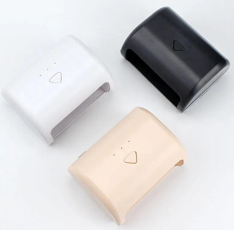 9W black LED UV nail lamp with dual light source and timer buttons on a white surface