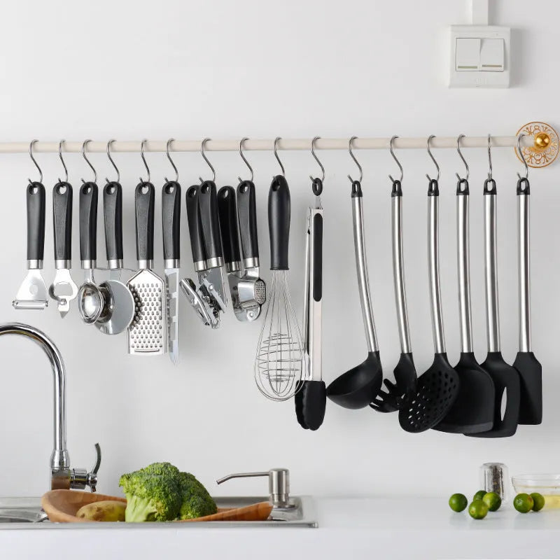 Black silicone spatula spoon set with stainless steel handles showing 16 kitchen utensils
